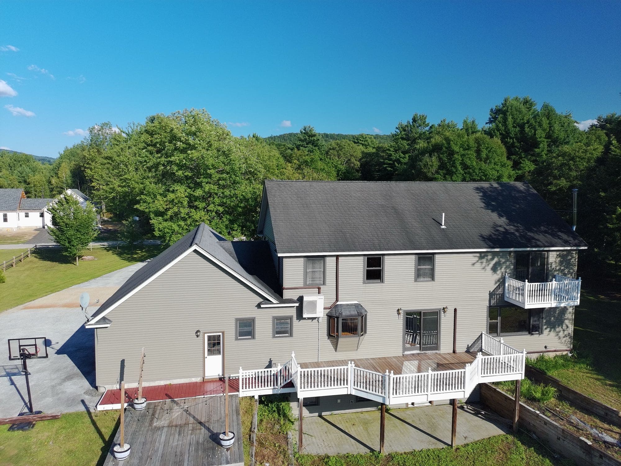 Aerial real estate photo showing a property's driveway and front approach