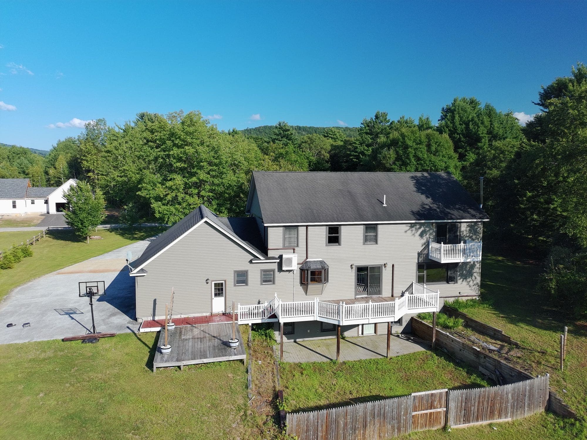 Overhead drone shot of a Vermont home's roofline and lot layout