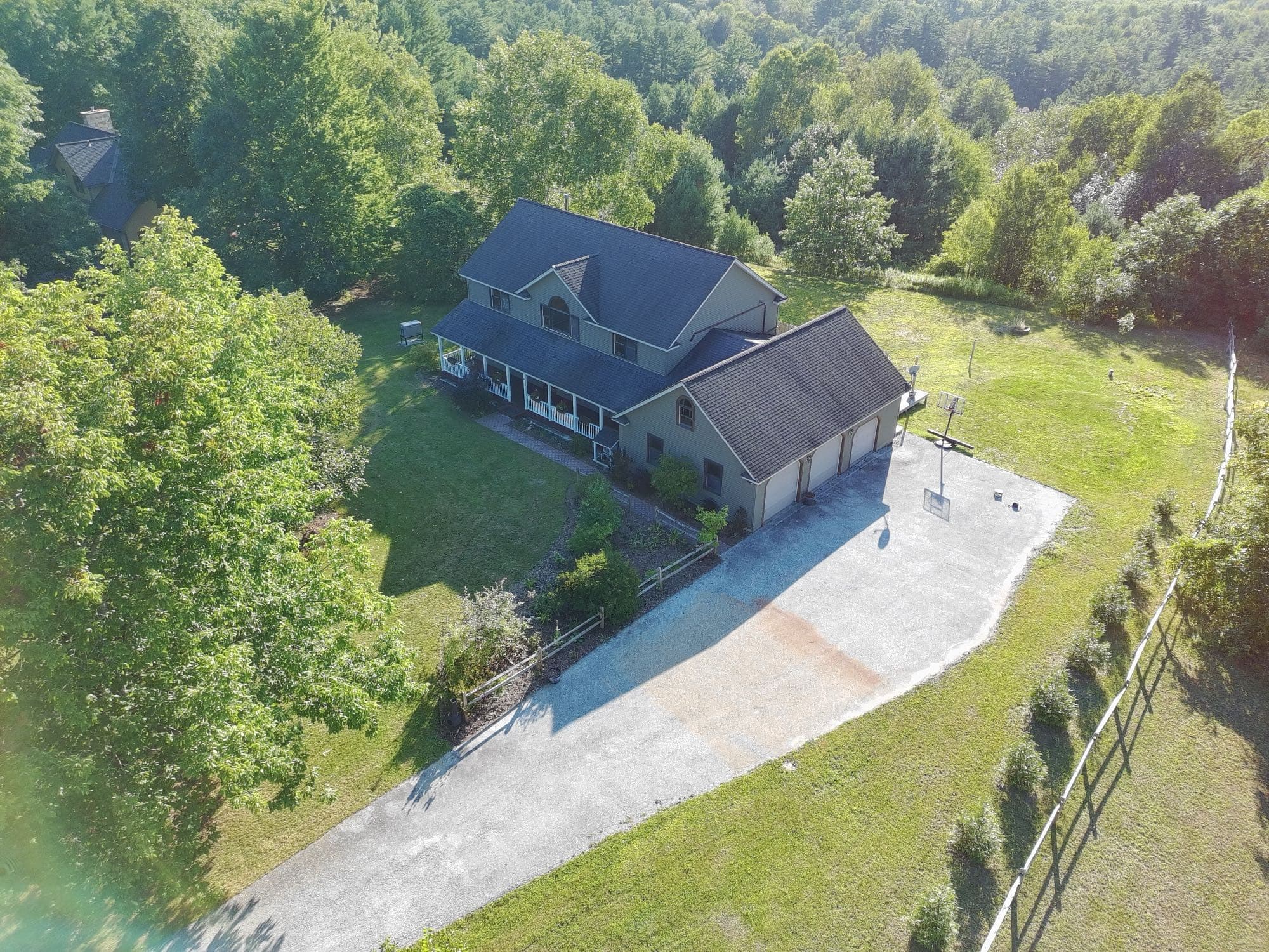 Aerial real estate photo highlighting a property's land and setbacks