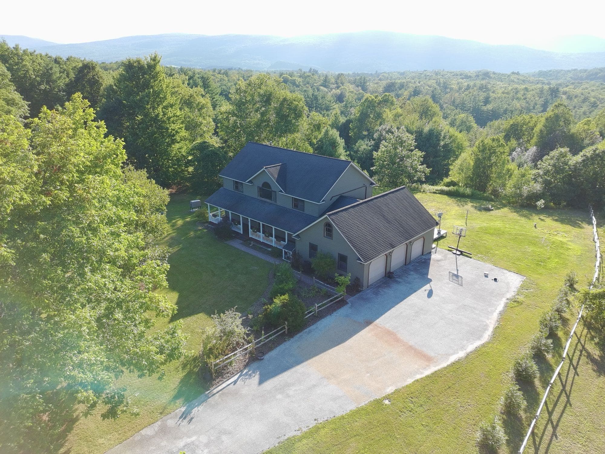Elevated view of a Vermont home and its surrounding acreage