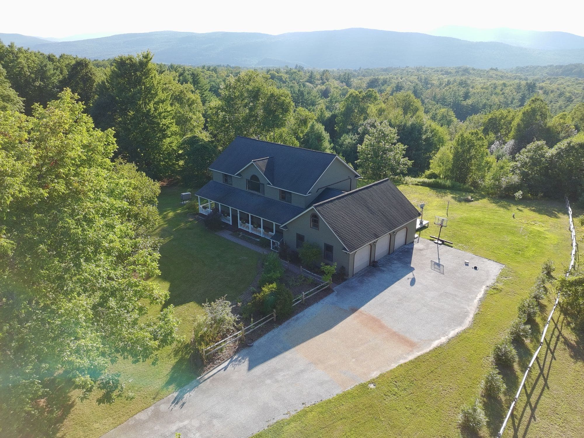 Aerial shot of a property entrance and landscaped front yard