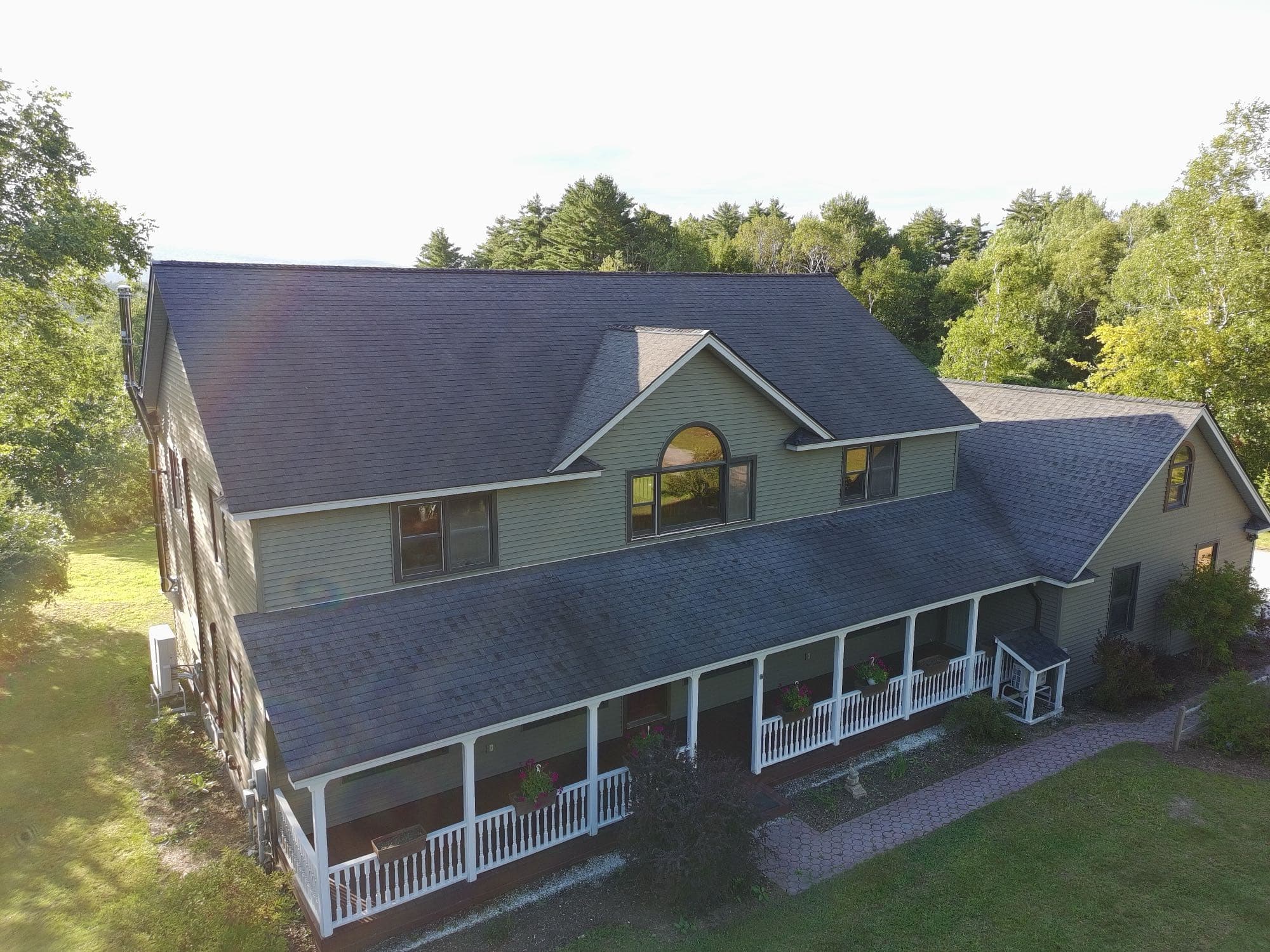Aerial photo of a home's exterior and surrounding grounds