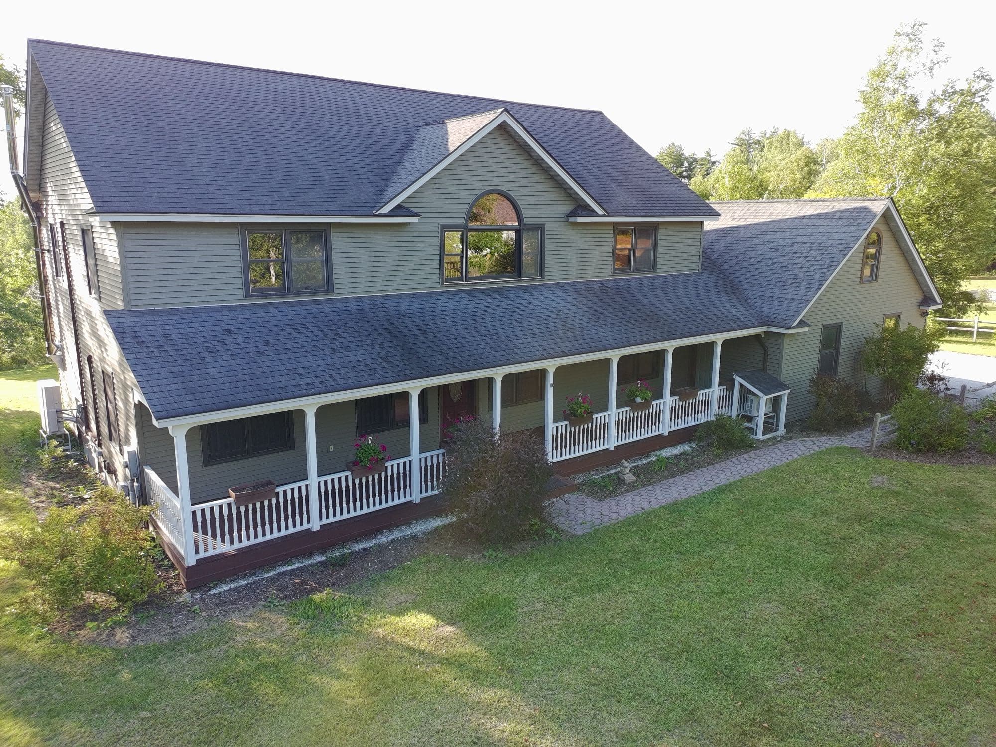 Elevated drone shot of a Vermont property's land and layout